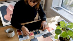 Hands using tablet with branding swatches