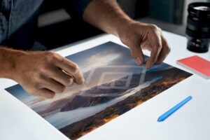 Hands positioning a logo watermark over photo
