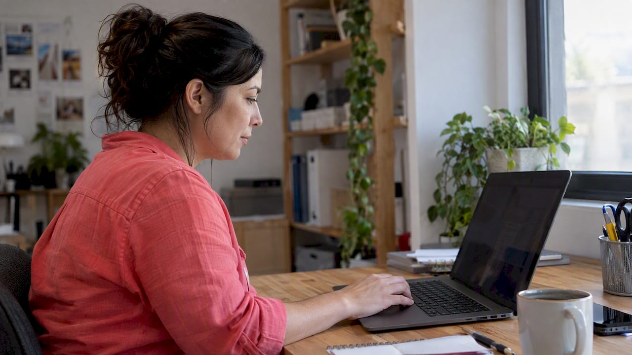 Editor tagging digital content on laptop