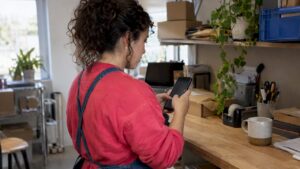 Small-business owner reviewing social post engagement