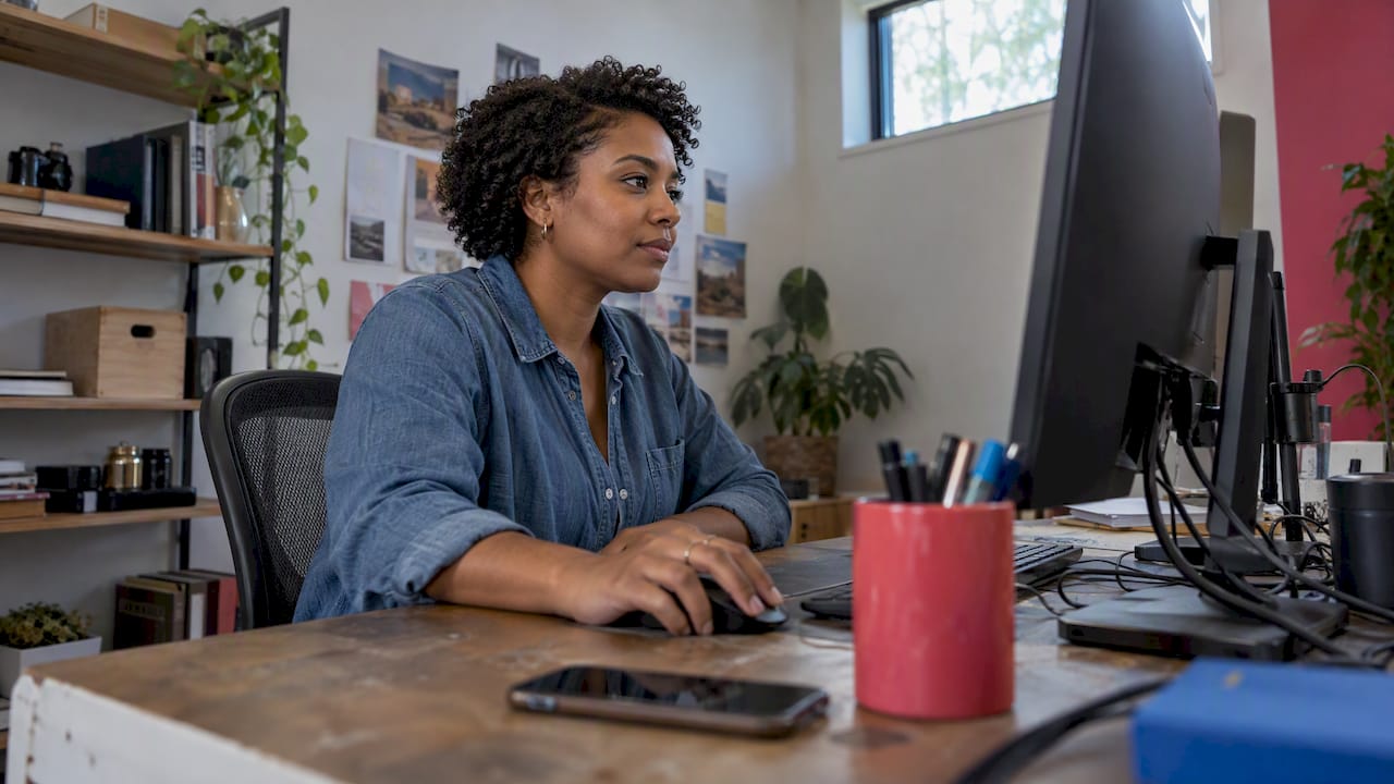 Marketer editing a social post at desktop